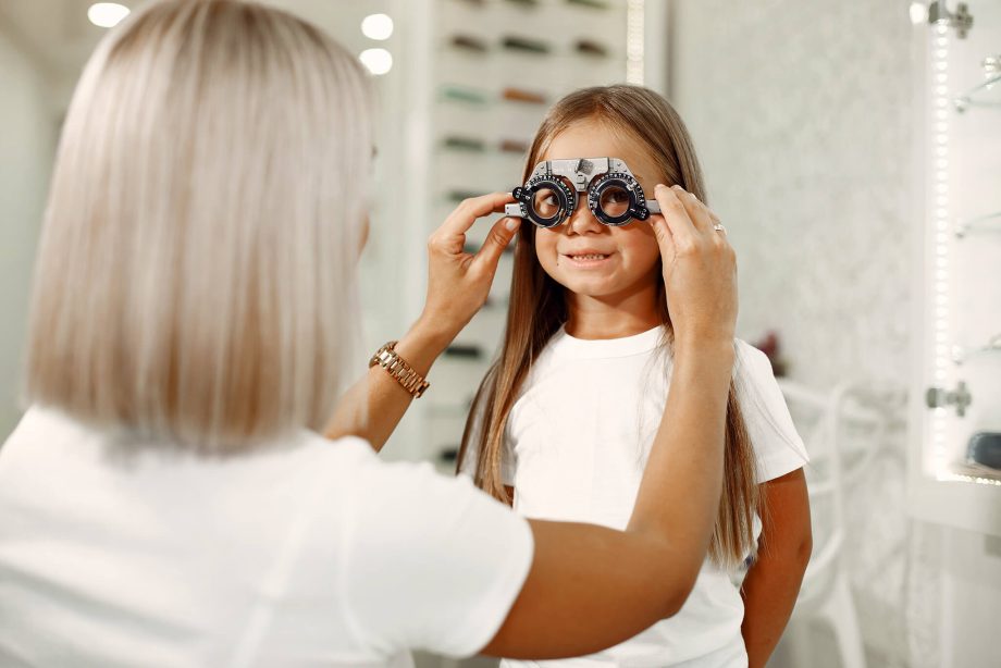 child-eye-test-and-eye-exam-little-girl-having-eye-check-up-with-phoropter-doctor-performs-eye-test-for-child